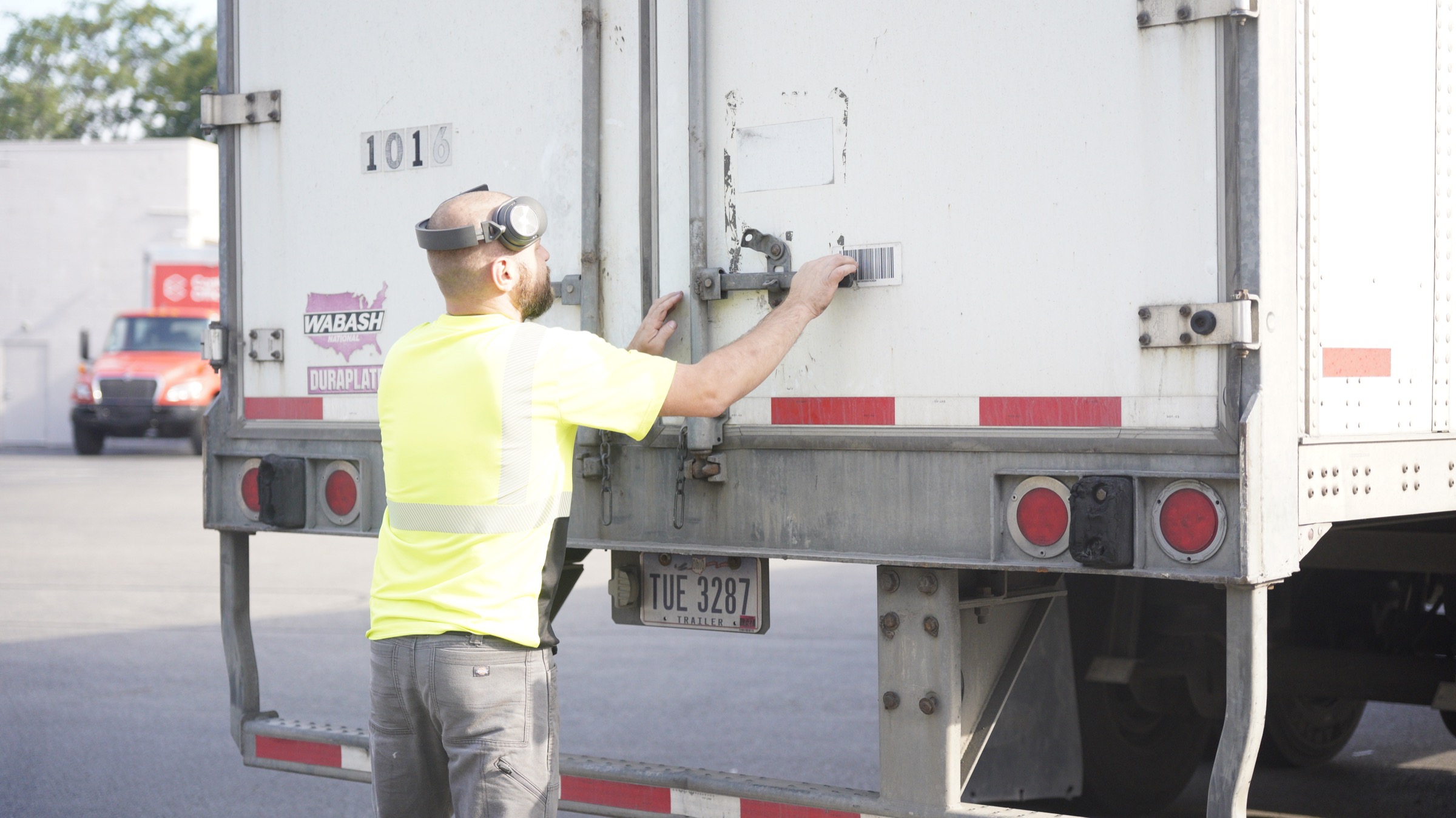 Freight worker preparing a trailer for transport